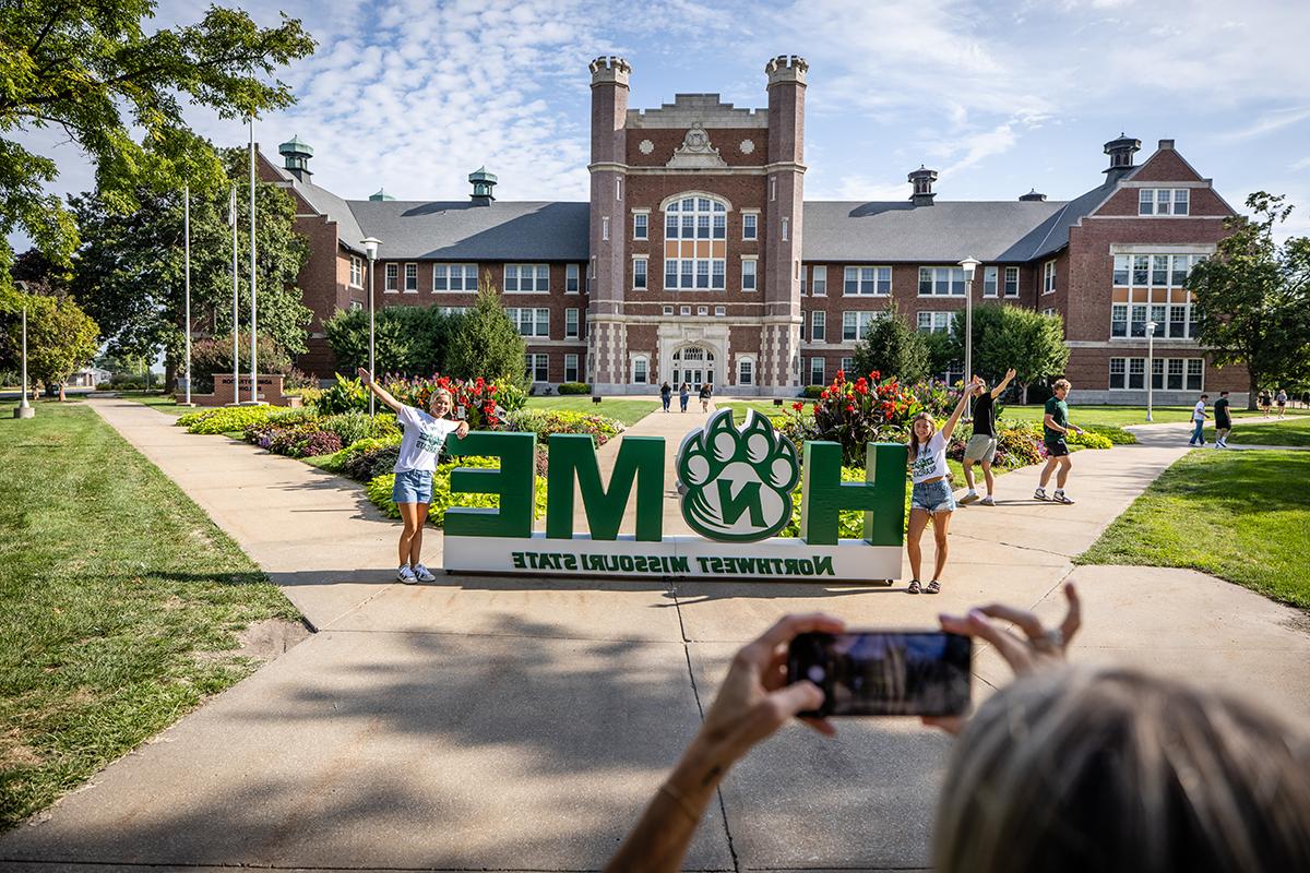 Students posed for photos in front of Northwest's Administration Building as they arrived to begin the fall semester in August. (Photo by Todd Weddle/Northwest Missouri State University)